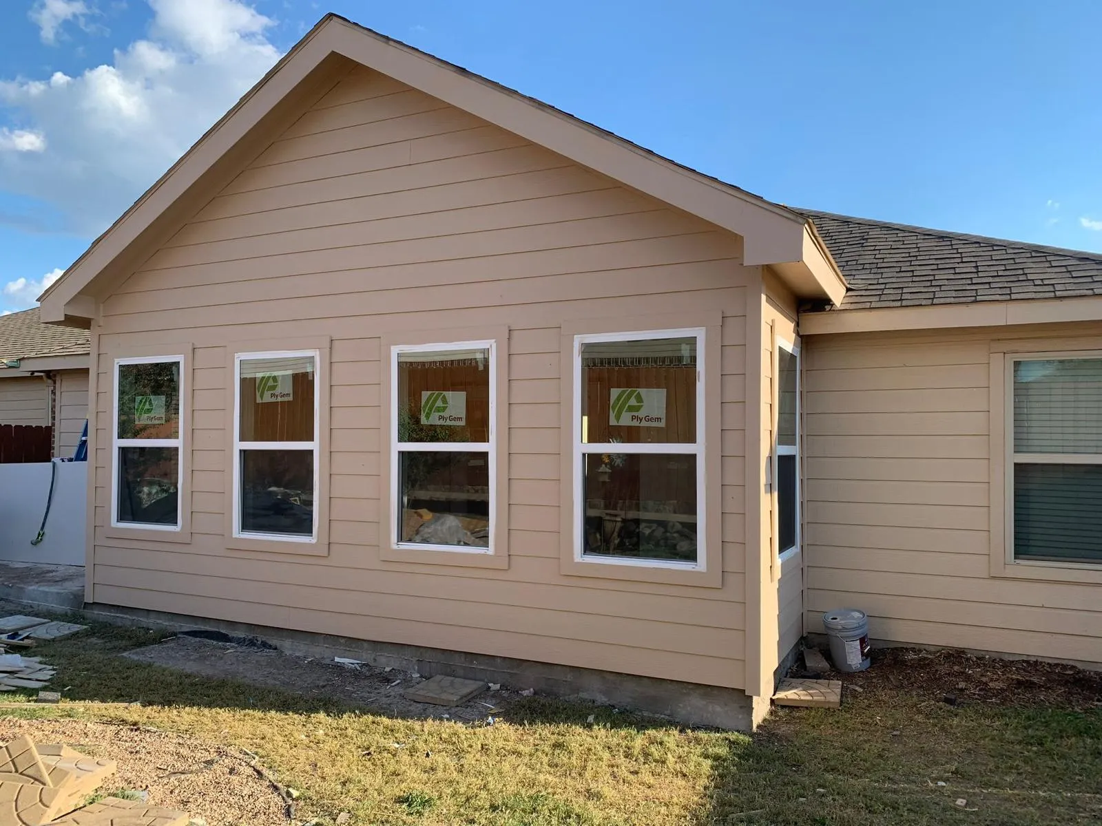Finished room addition with siding and new windows
