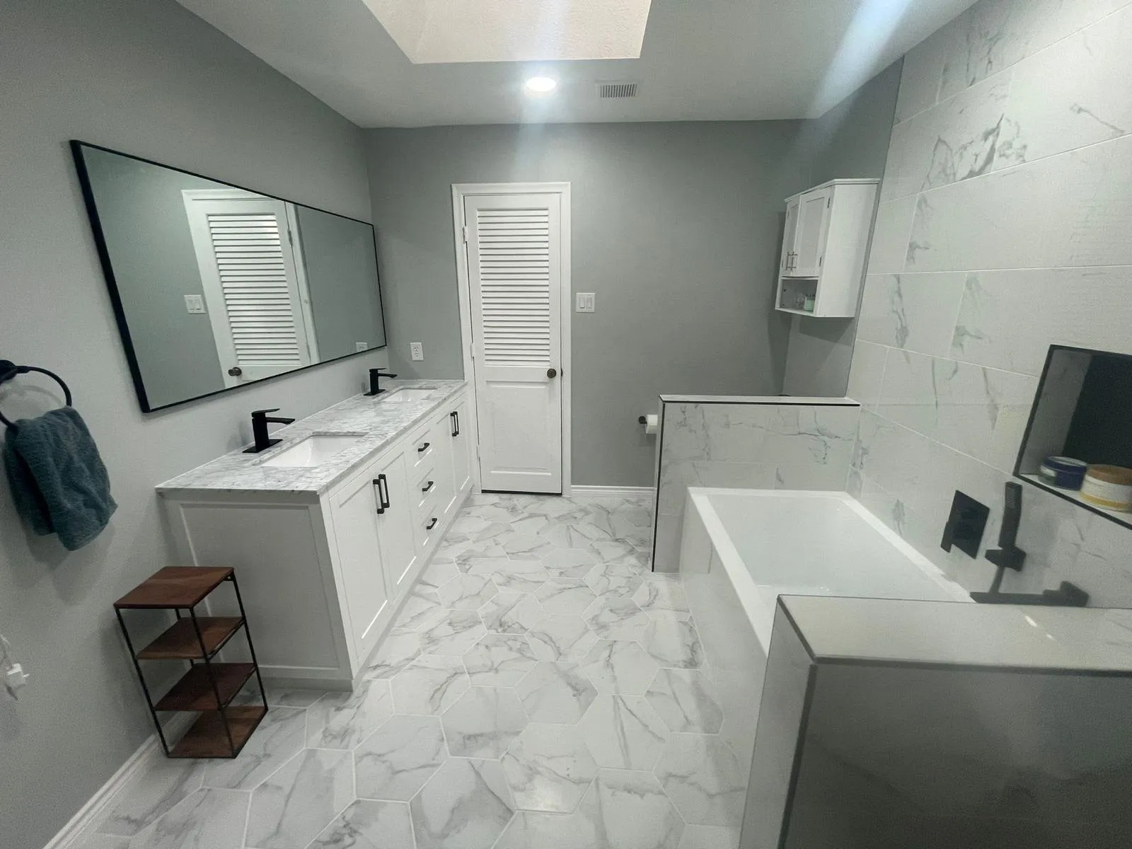 Remodeled bathroom with double vanity and soaking tub, Dallas