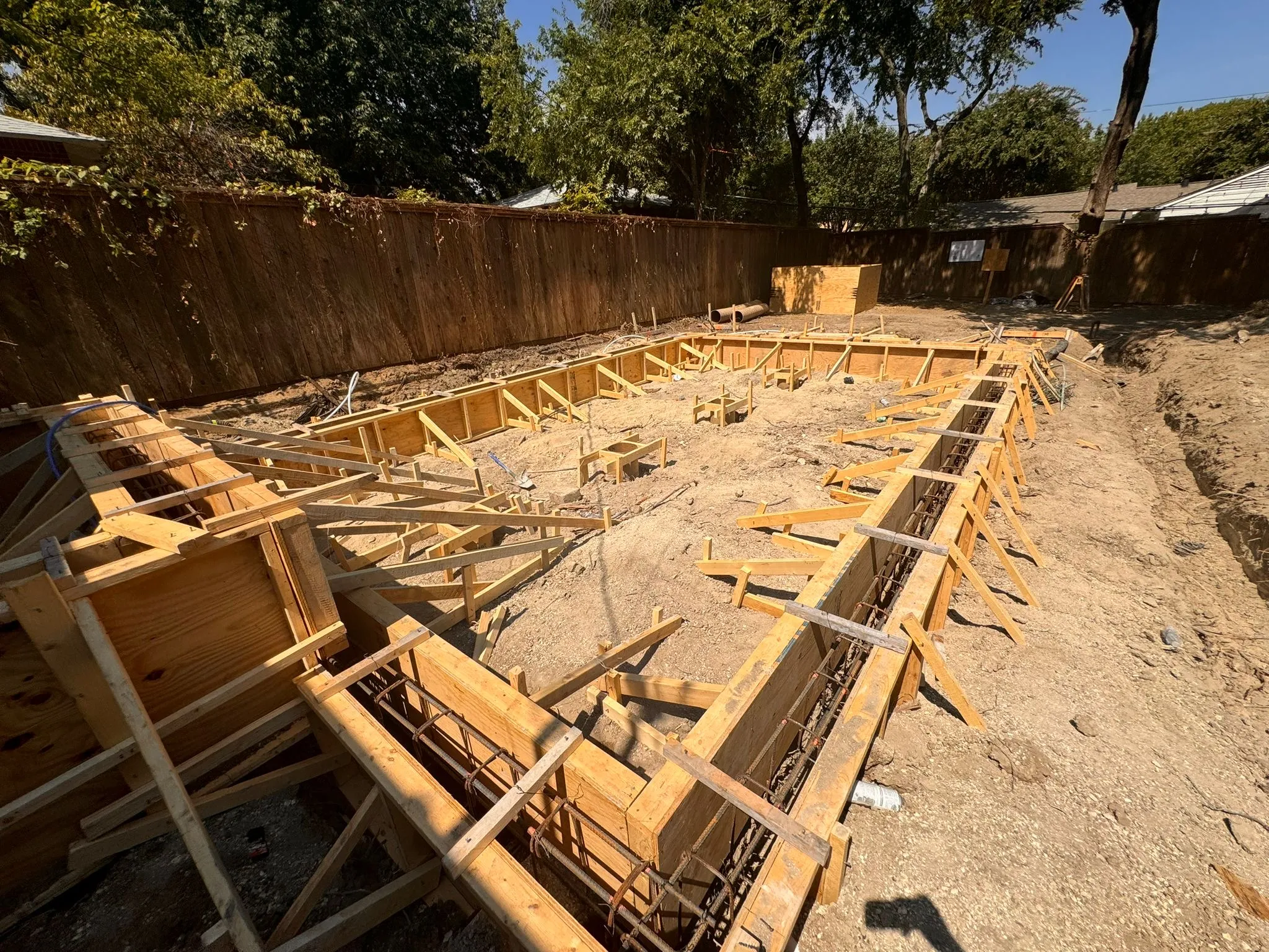 Foundation forms and rebar for a backyard ADU