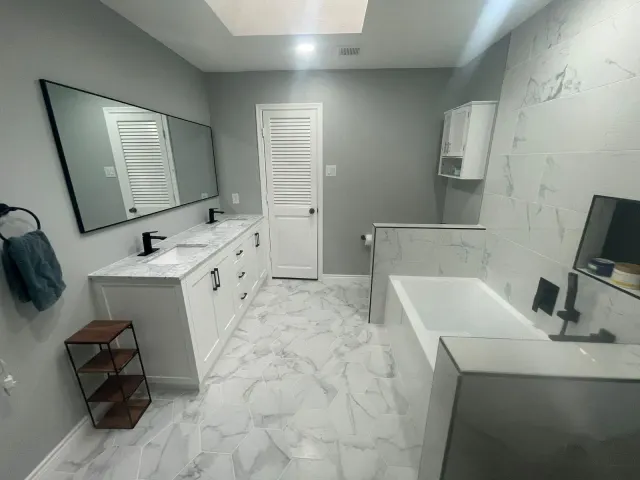 Finished bathroom with double vanity, mirror and soaking tub, Dallas
