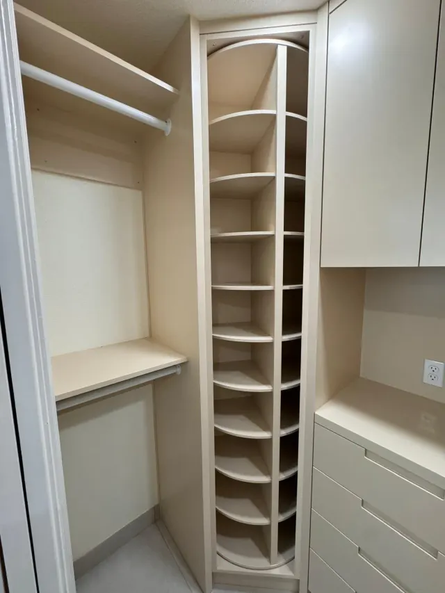 Custom closet built-ins with shelves, drawers and shoe tower