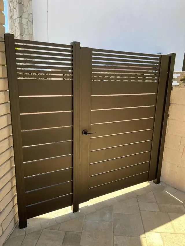 Modern dark horizontal slat privacy gate
